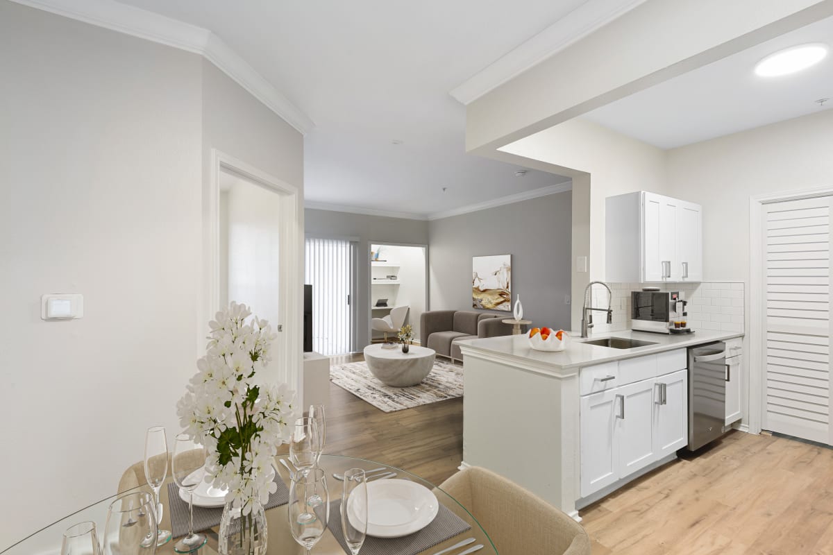 Modern kitchen with wood-style floors at Lantower Round Rock in Round Rock, Texas