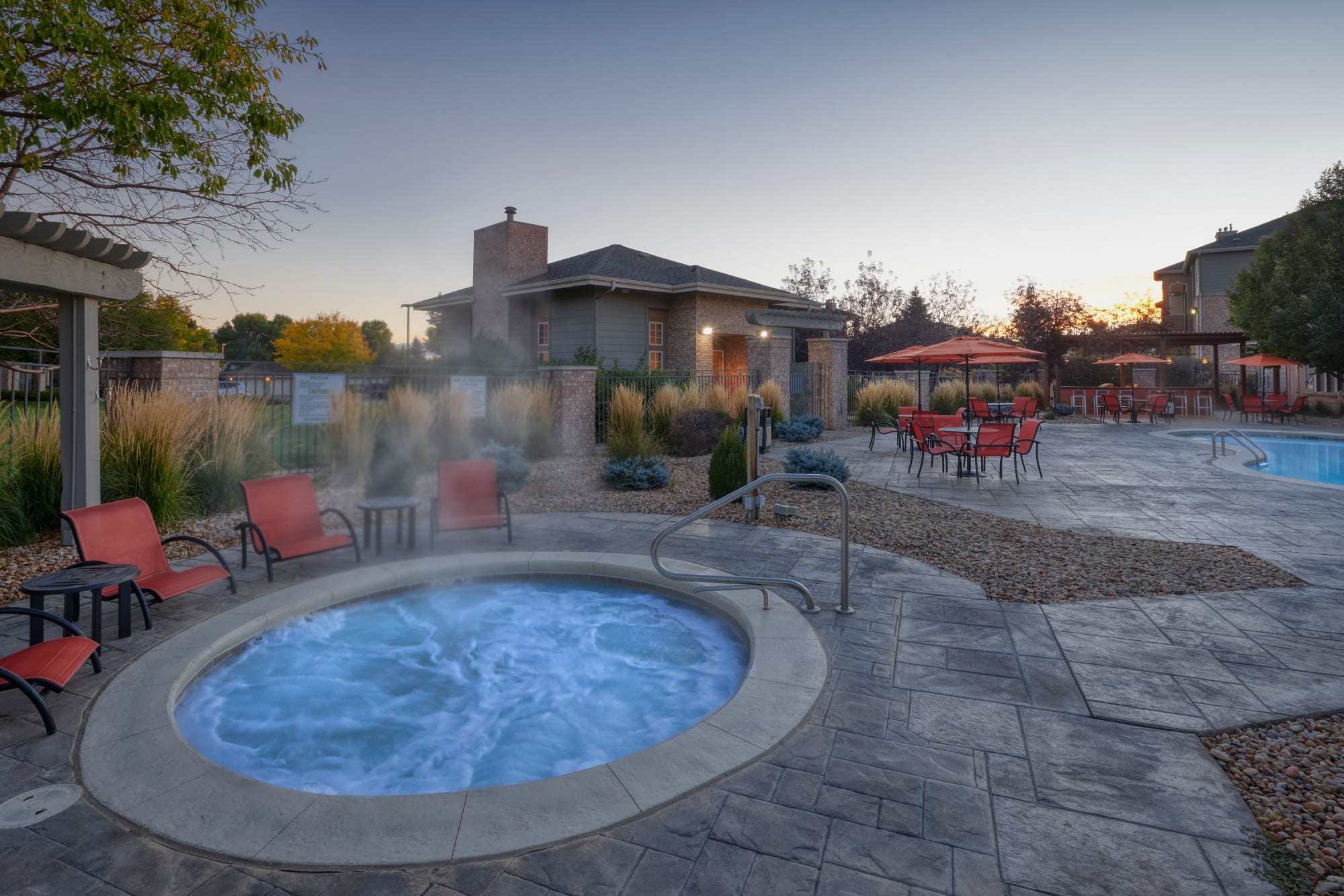 The relaxing hot tub and swimming pool at Hawthorne Hill Apartments in Thornton, Colorado