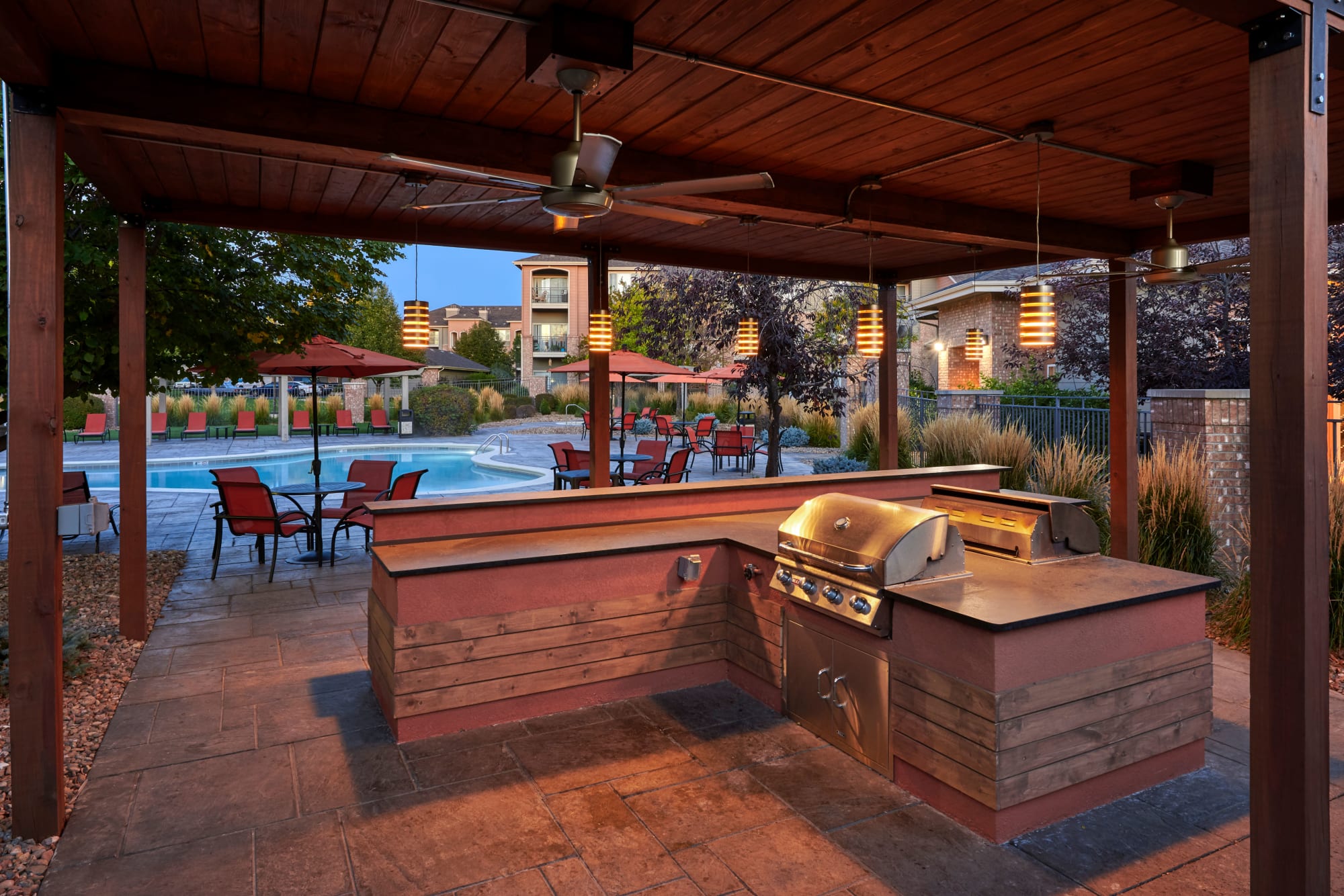 The poolside BBQ, perfect for entertaining friends, at Hawthorne Hill Apartments in Thornton, Colorado