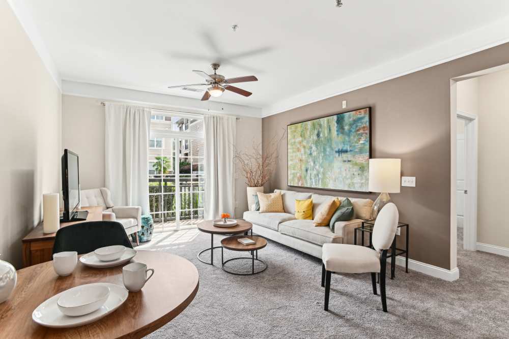Well-furnishes living area at Fountains at Mooresville Town Square in Mooresville, North Carolina