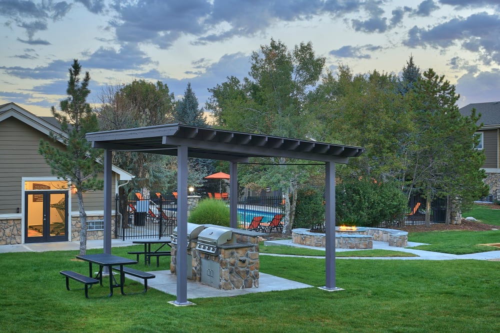 Covered barbecue area at Crossroads at City Center Apartments in Aurora, Colorado