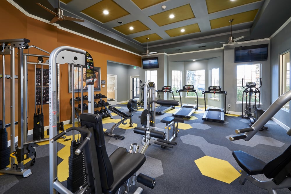 Fitness center with plenty of individual workout stations at Legend Oaks Apartments in Aurora, Colorado