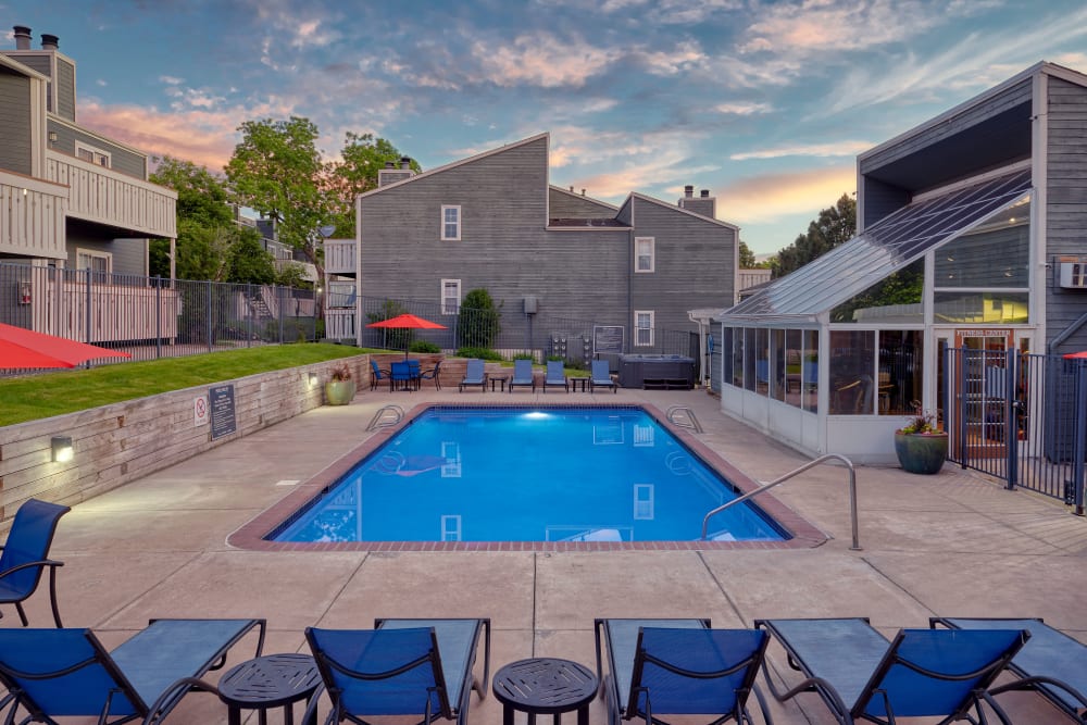 Beautiful resort-style swimming pool at sunset at Bluesky Landing Apartments in Lakewood, Colorado