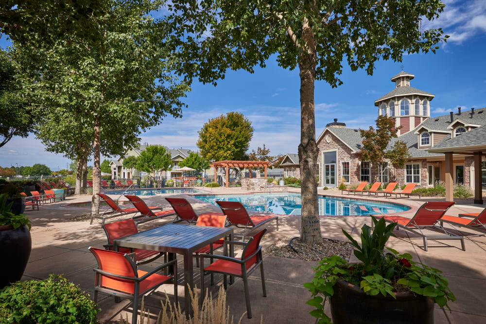 Beautiful resort-style swimming pool with lounge chairs at Gateway Park Apartments in Denver, Colorado