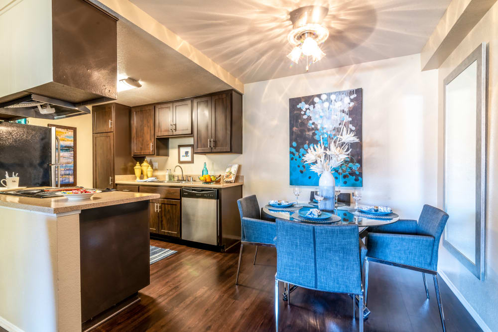 Dining room with wood-style flooring at Terra Nova Villas in Chula Vista, California