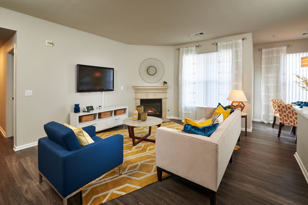 Living room with hardwood-style floors at Bear Valley Park in Denver, Colorado