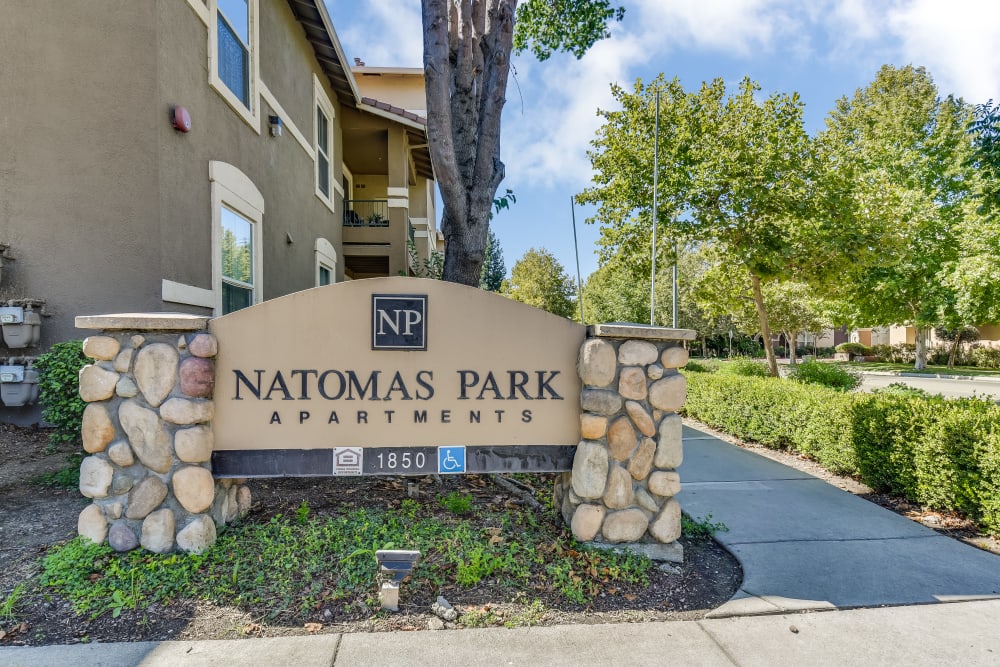 The front monument sign at Natomas Park Apartments in Sacramento, California