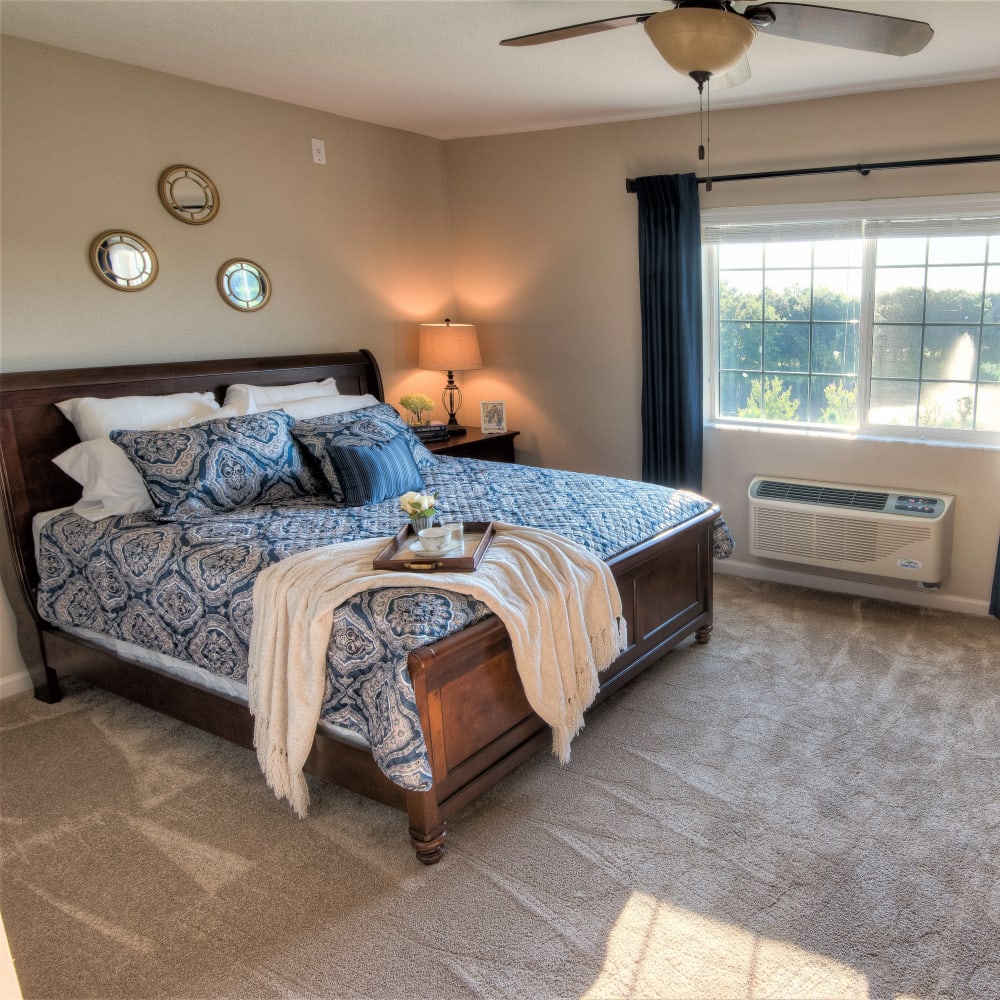 Resident bedroom at Inspired Living Lewisville in Lewisville, Texas.