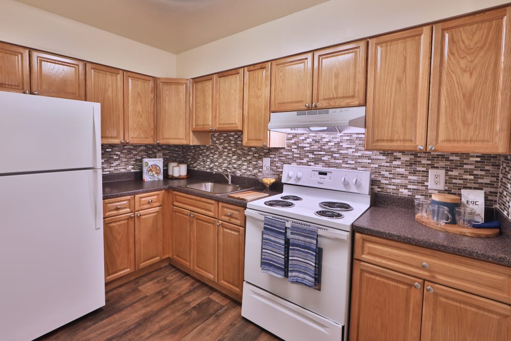 Kitchen with white appliance at The Willows Apartment Homes in Glen Burnie, Maryland