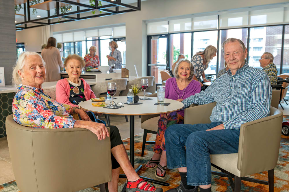 Resident smiling with a flower at Anthology of Edmonds in Edmonds, Washington