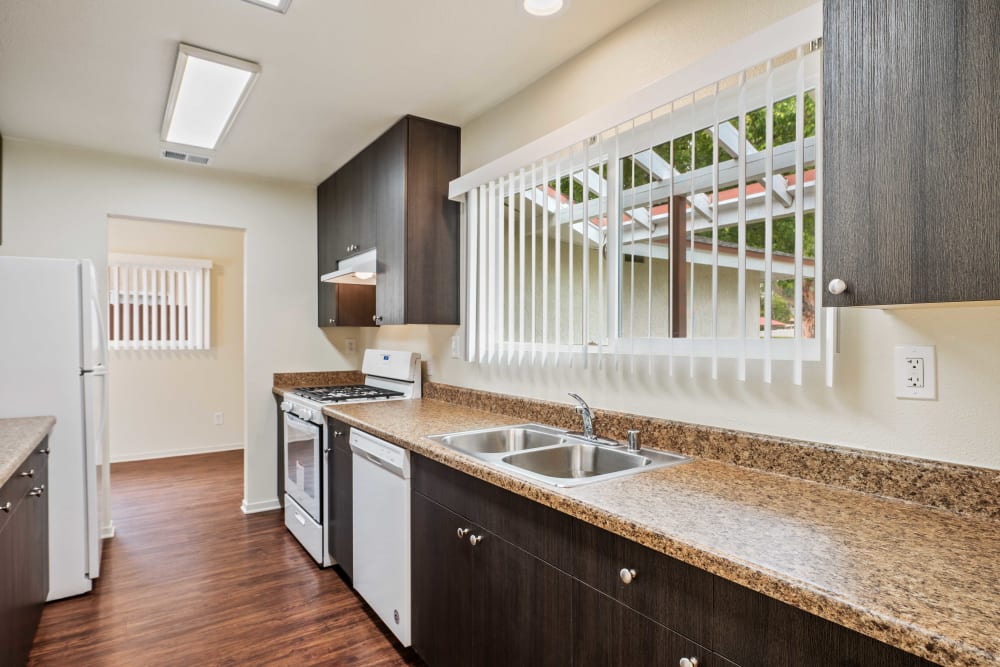 A kitchen with a dishwasher at Coral Sea Cove in Port Hueneme, California