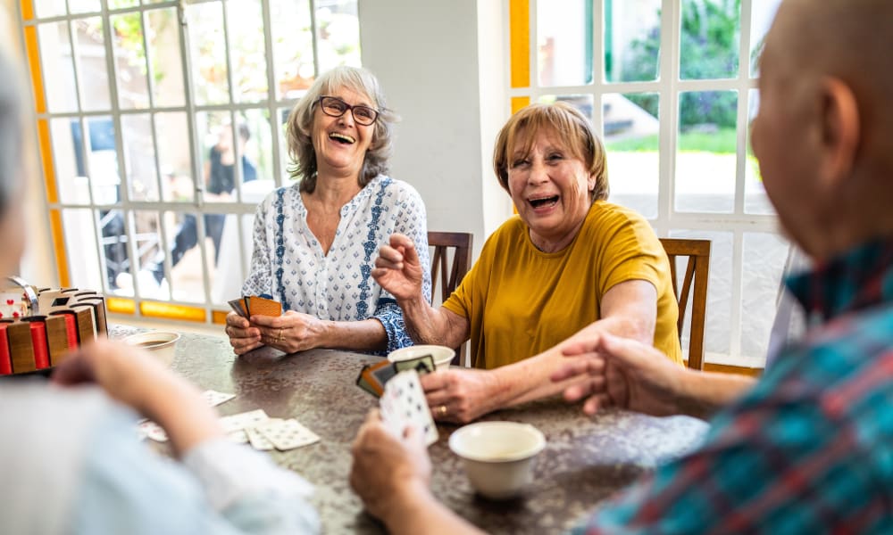 Residents playing a card game at Amaran Senior Living in Albuquerque, New Mexico.