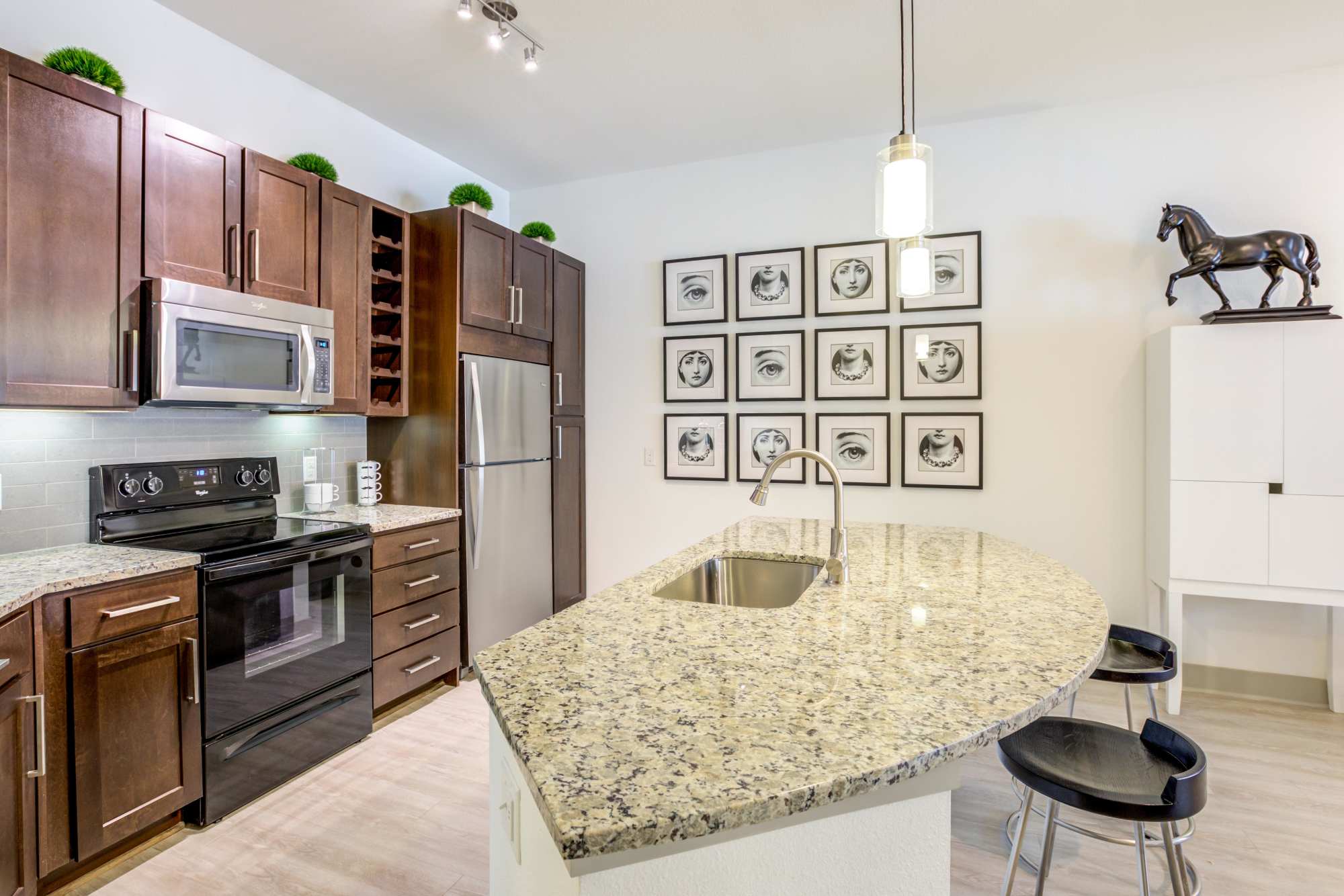 View of open kitchen at Helios in Englewood, Colorado