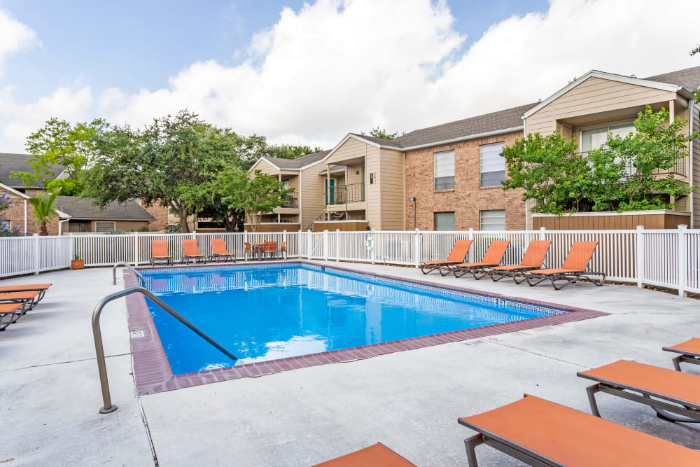 Relaxing pool area at Riverstone Apartments in Bryan, Texas