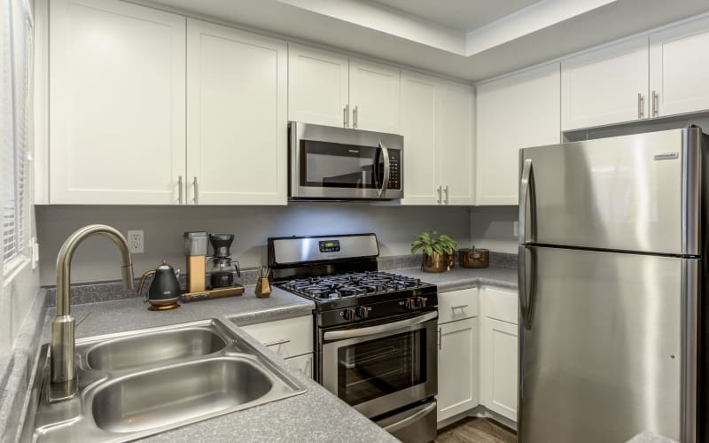 Renovated kitchen with white cabinets at Village Oaks in Chino Hills, California