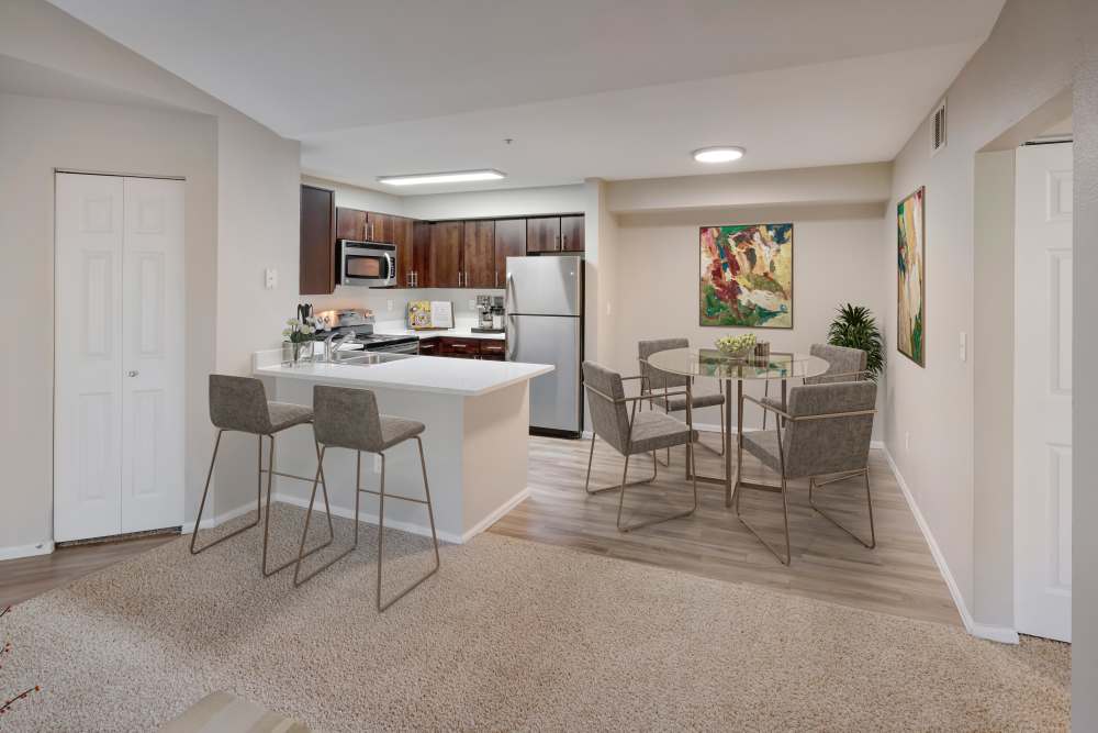 Kitchen and dining room at The Crossings at Bear Creek Apartments in Lakewood, Colorado