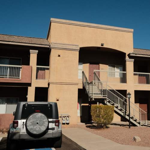 Exterior view of the apartment with parking space at Tierra Vida in Tucson, Arizona
