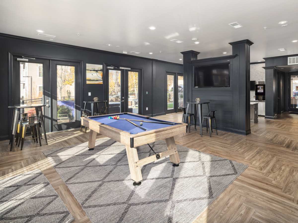 Gated pool table with cues and balls at Ardmore & Twenty Eighth in Atlanta, Georgia