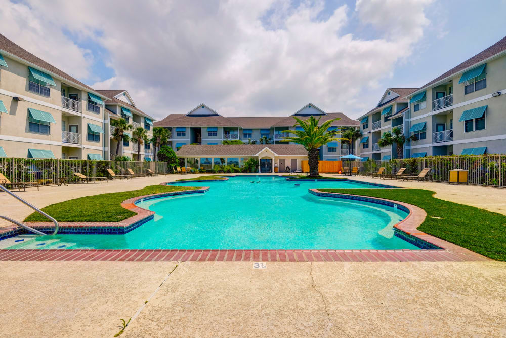Exterior building with pool at Harborside Apartment Homes in Slidell, Louisiana