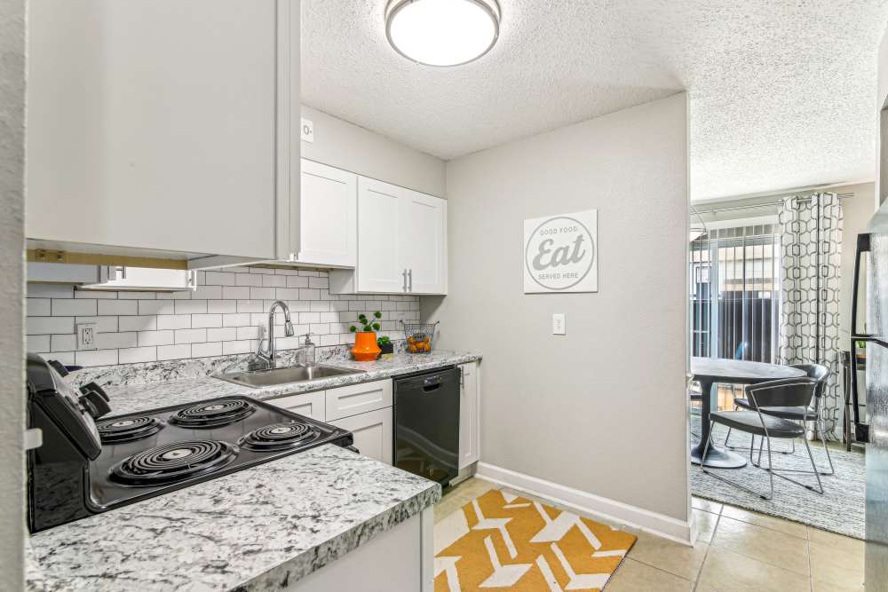 Modern apartment kitchen with stainless-steel appliances at Elliot Norcross in Norcross, Georgia