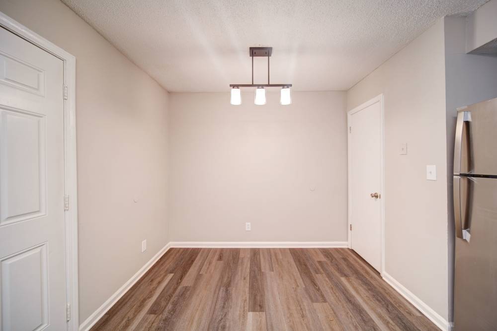 Unfurnished living room at The Manor Townhomes in Winston-Salem, North Carolina