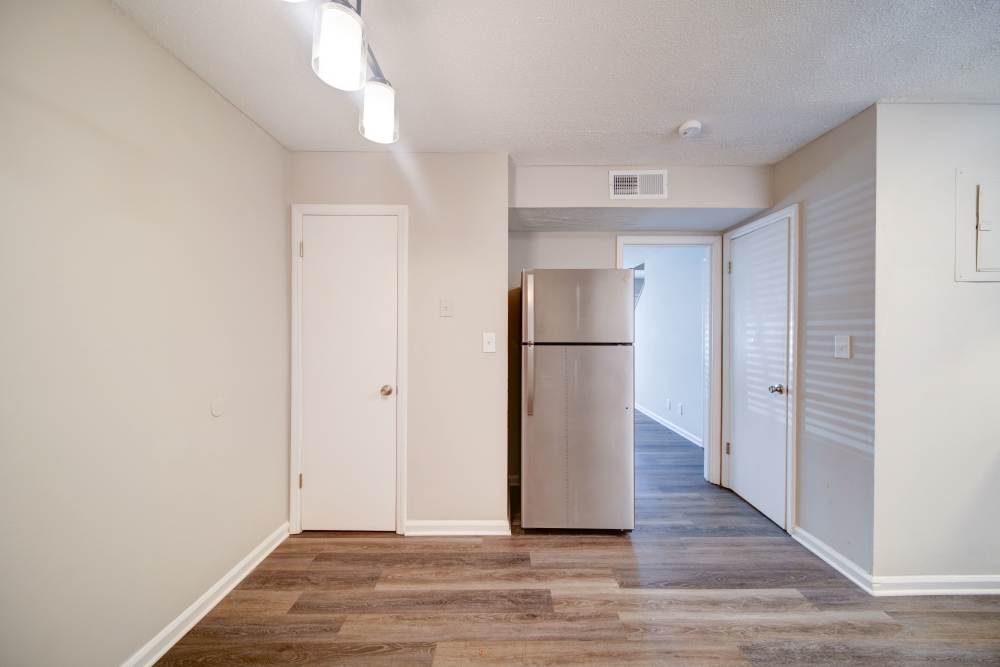 View of refrigerator with wooden flooring near The Manor Townhomes in Winston-Salem, North Carolina
