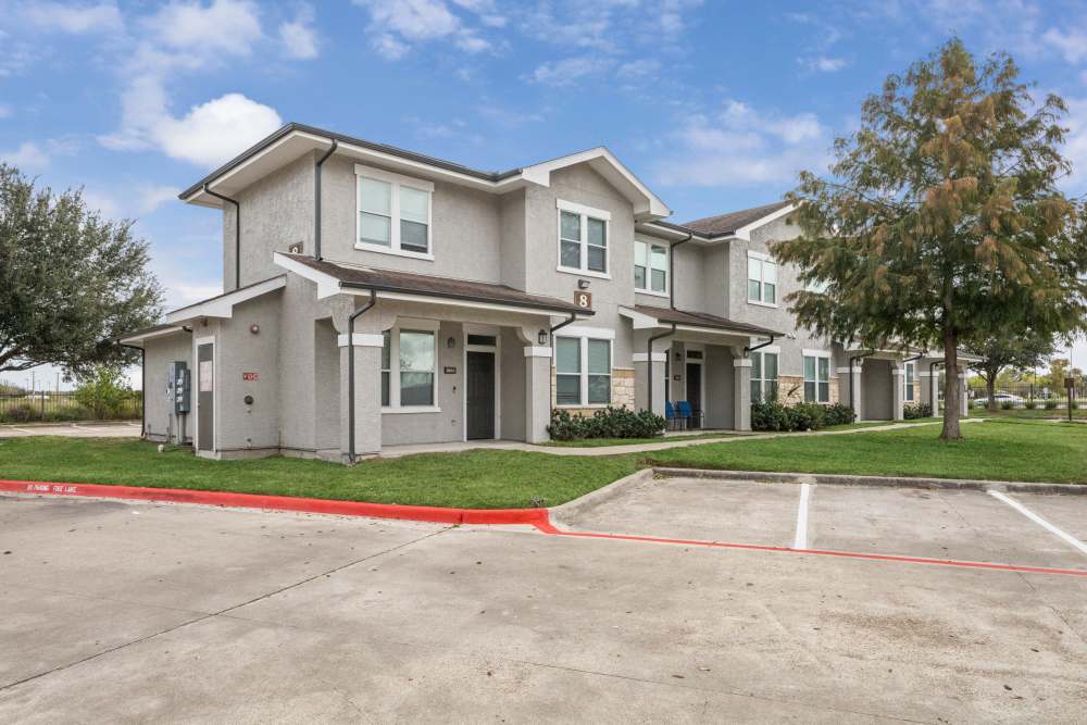 Parking view of apartment at The Cove at Palmer Point in Texas City, Texas