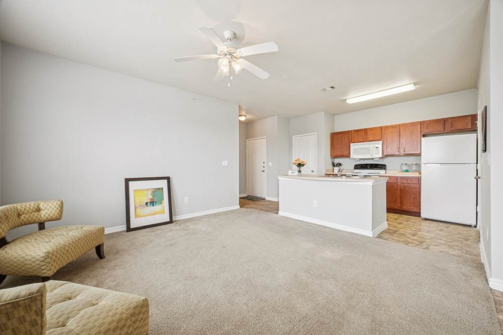 Spacious living room and kitchen viewat The Cove at Palmer Point in Texas City, Texas