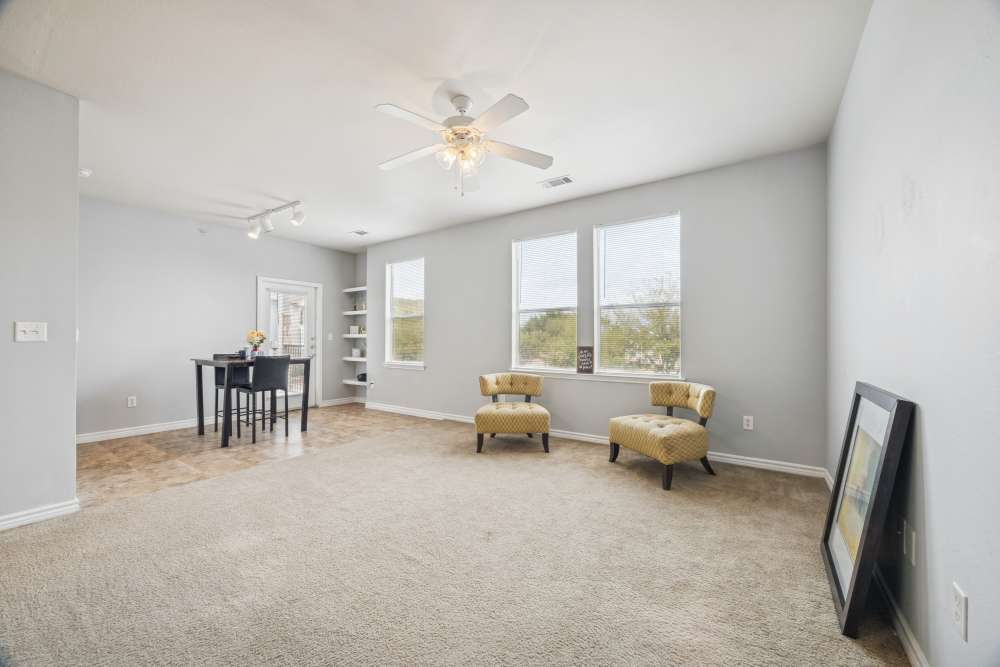 Bright living room with dining table view and windows at The Cove at Palmer Point in Texas City, Texas