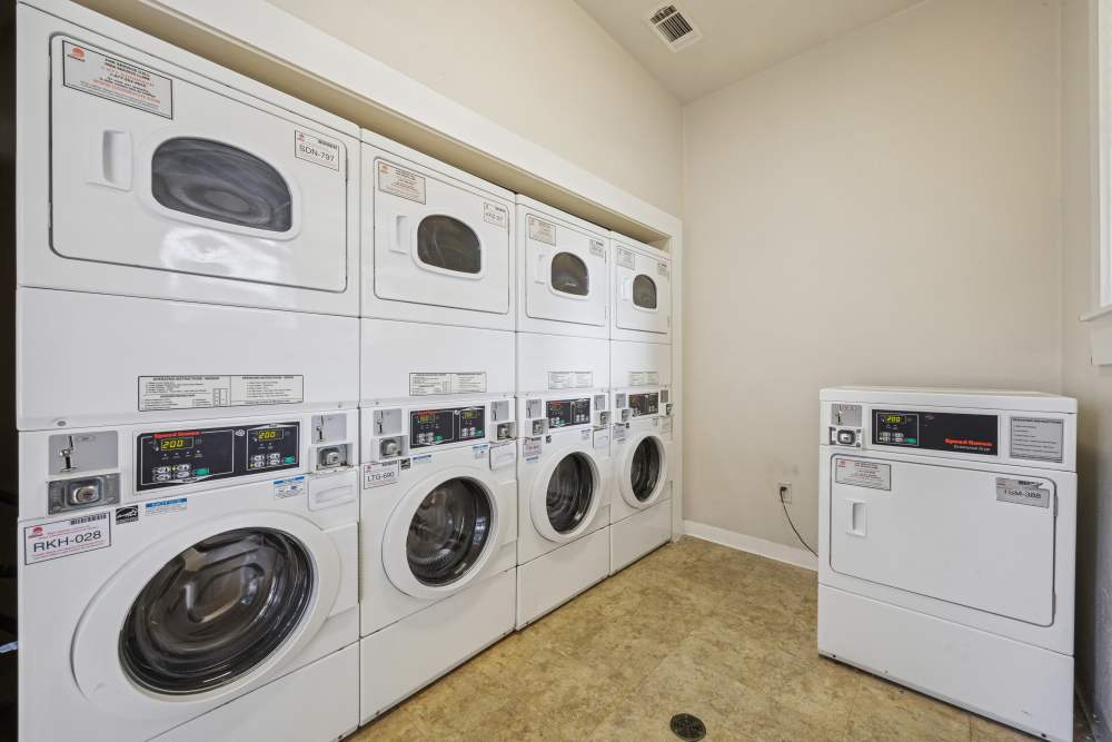 Laundry room with washer & dryer at The Cove at Palmer Point in Texas City, Texas