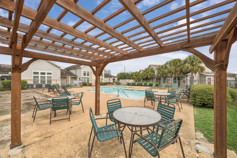 Canopy seating near pool at The Cove at Palmer Point in Texas City, Texas