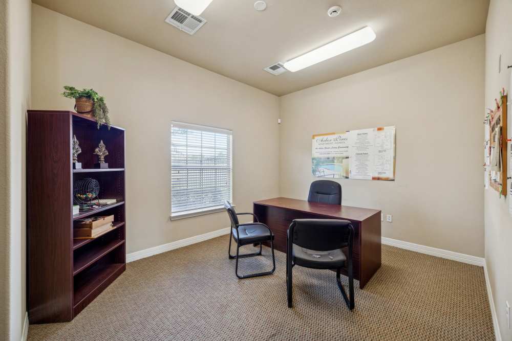 Cozy office space with natural light and ample storage at Arbor Pines in Orange, Texas.