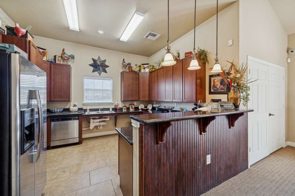 Stylish modern kitchen featuring elegant cabinetry and ample counter space at Arbor Pines in Orange, Texas.