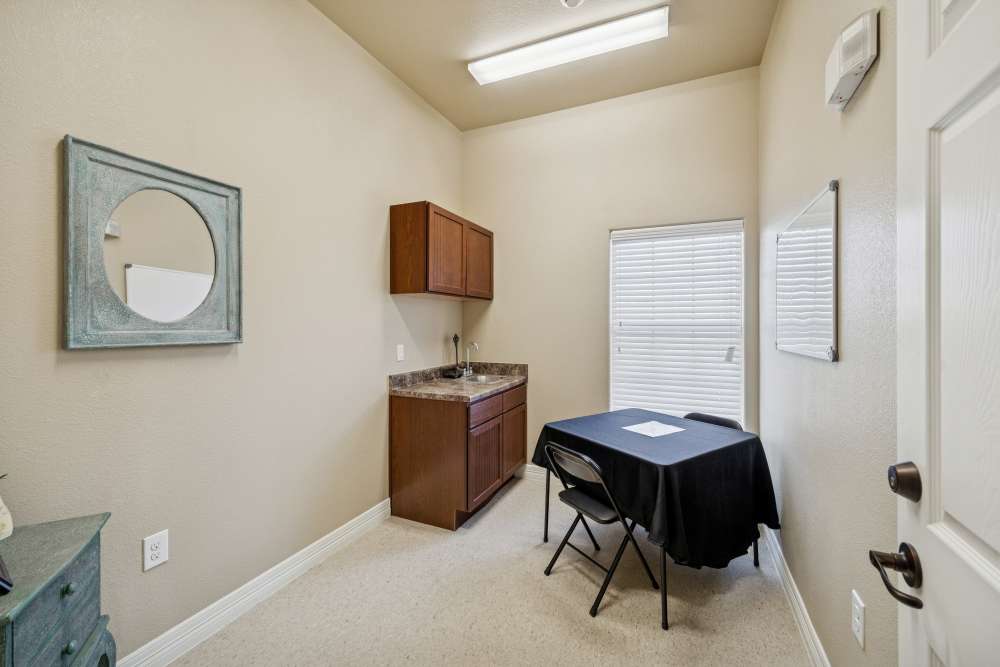 Cozy workspace featuring sleek cabinetry and natural light at Arbor Pines in Orange, Texas.