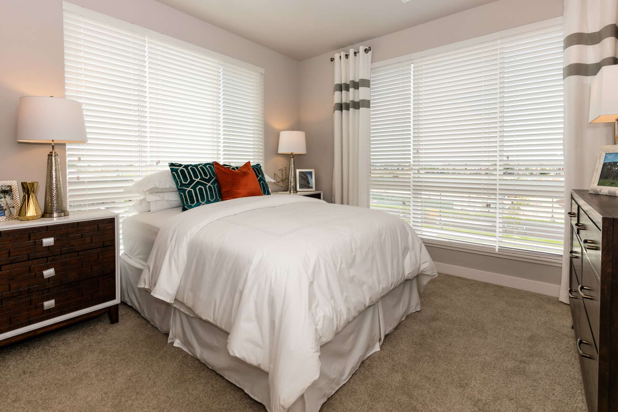 Bedroom with carpet at Strata Apartments in Denver, Colorado
