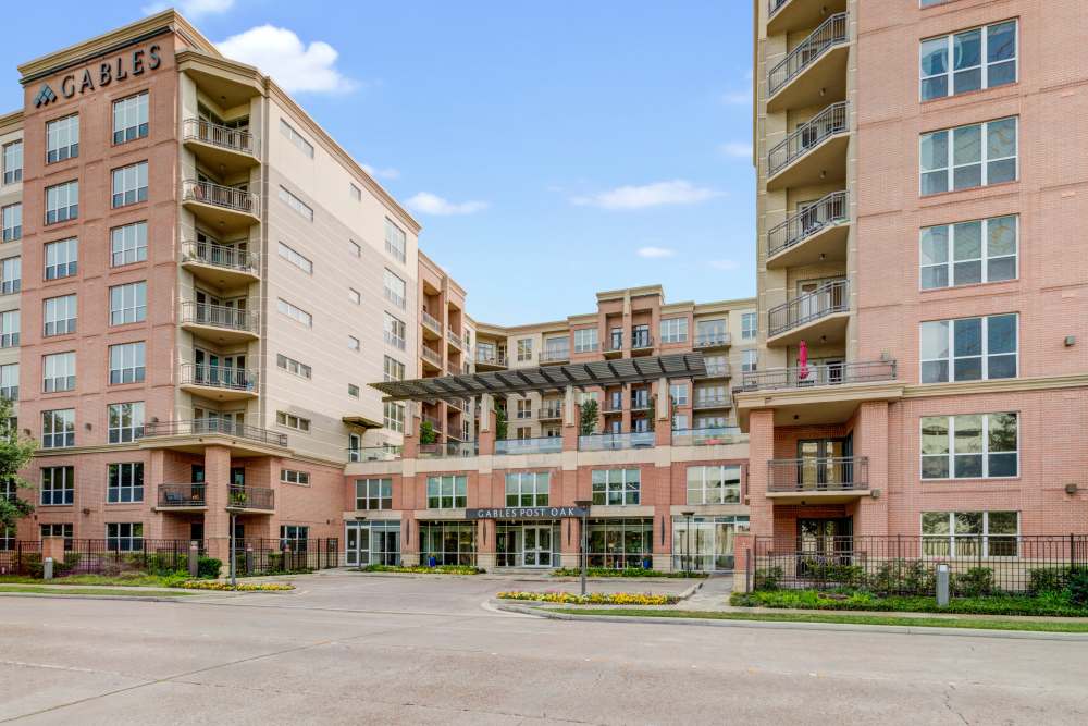 Charming community living featuring modern architecture and lush landscaping at Hollings Post Oak in Houston, Texas