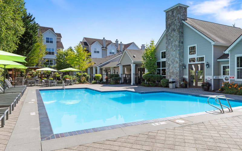 Swimming pool and deck area at HighGrove Apartments in Everett, Washington