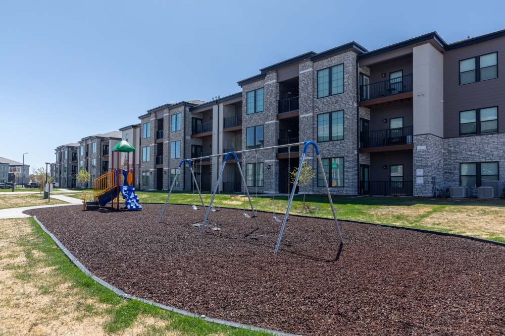 Playground with community apartment at The Reserves at Eagle Point in Aurora, Colorado