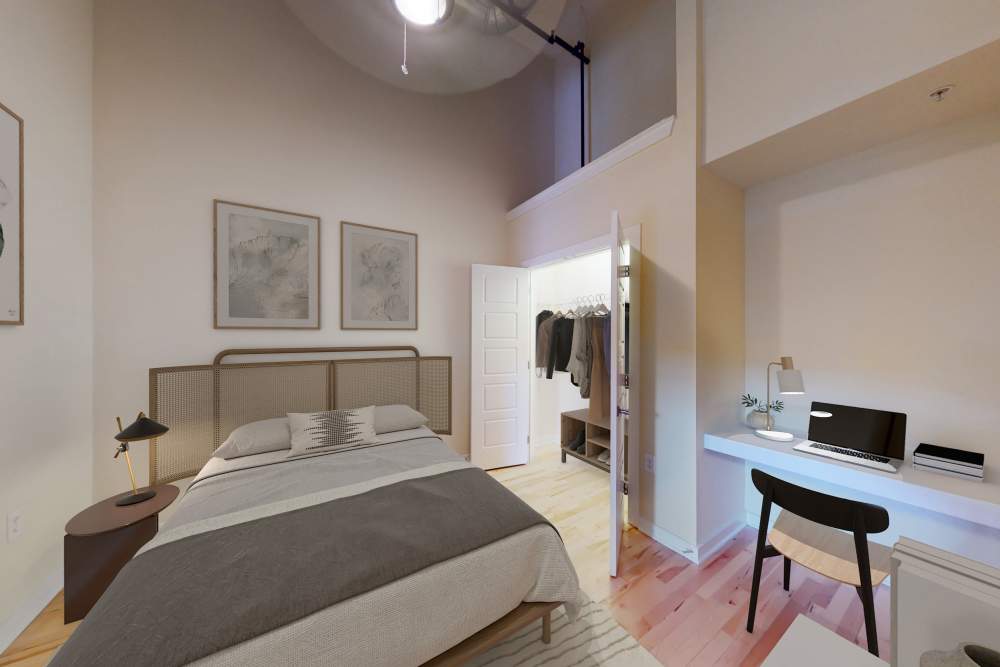 Well-designed modern bedroom with closet at Perry Street Lofts in Petersburg, Virginia