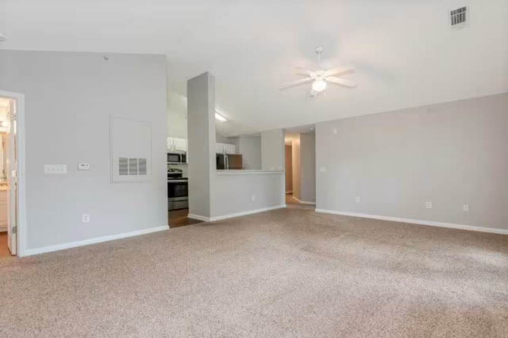 Spacious living room with ceiling lights at Arbors at Fairview Apartments in Simpsonville, South Carolina