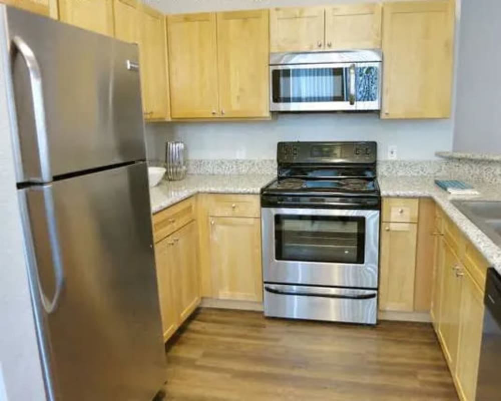 Kitchen with stainless-steel appliances at  Seville at Mace Ranch in Davis, California