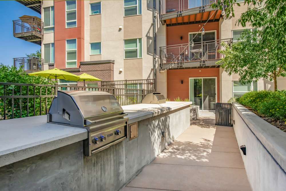 Outdoor barbeque area at Park Place Olde Town Apartments in Arvada, Colorado