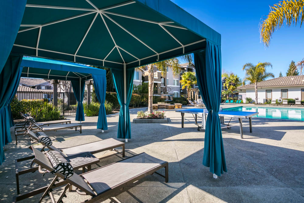 Swimming pool with cabanas and lounge chairs at Miramonte and Trovas in Sacramento, California
