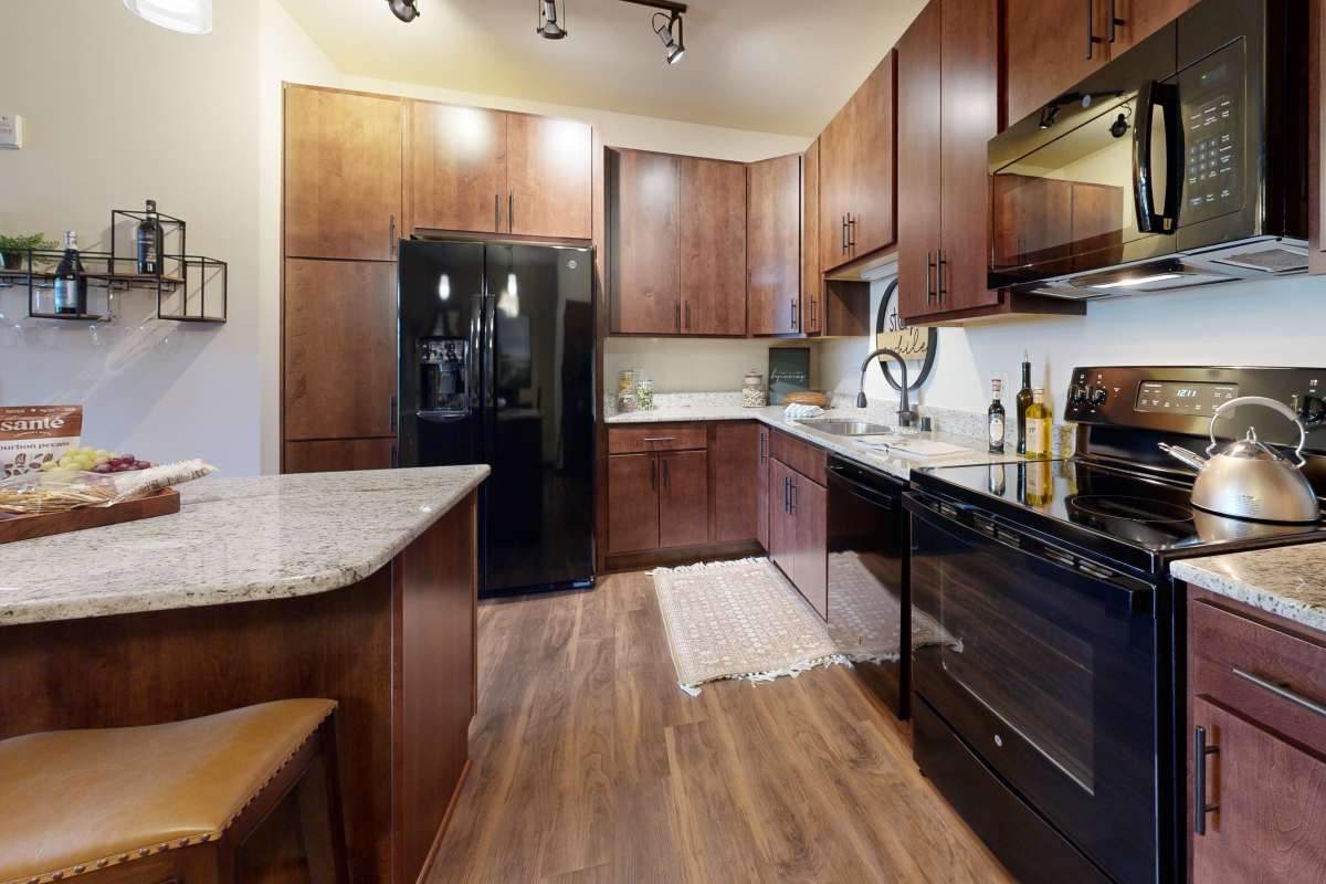 Well-equipped modern kitchen at The Tuscany On Pleasant View in Madison, Wisconsin