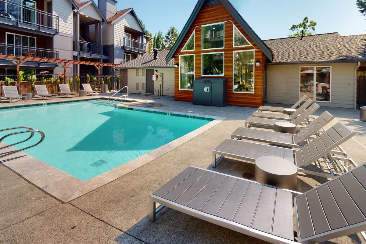 Poolside lounge chairs at Redmond Place Apartments in Redmond, Washington