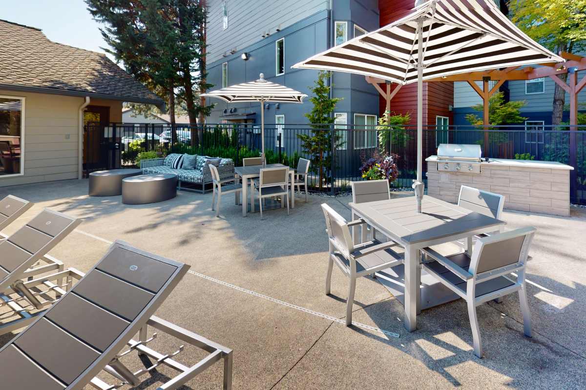 Poolside seating area at Redmond Place Apartments in Redmond, Washington