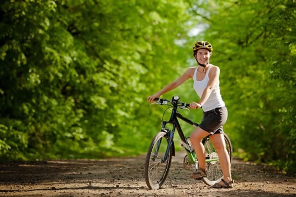 Riding a bike at Olympus Court Apartments in Bakersfield, California