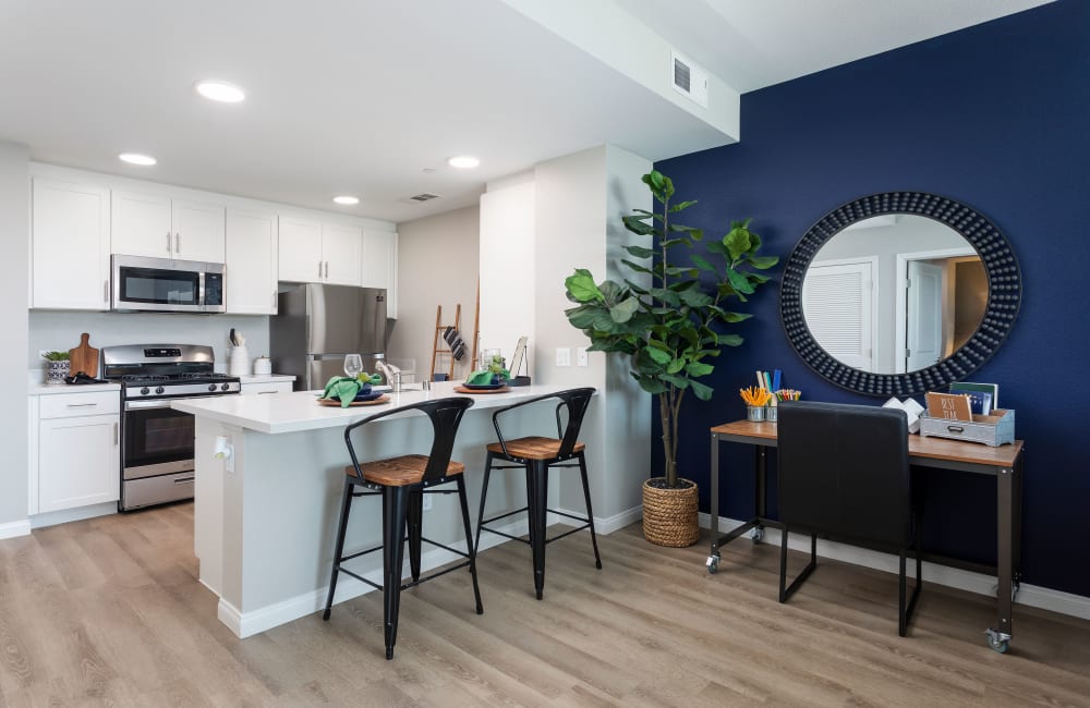 Model apartment kitchen and dining room at Azure Apartment Homes in Santa Maria, California