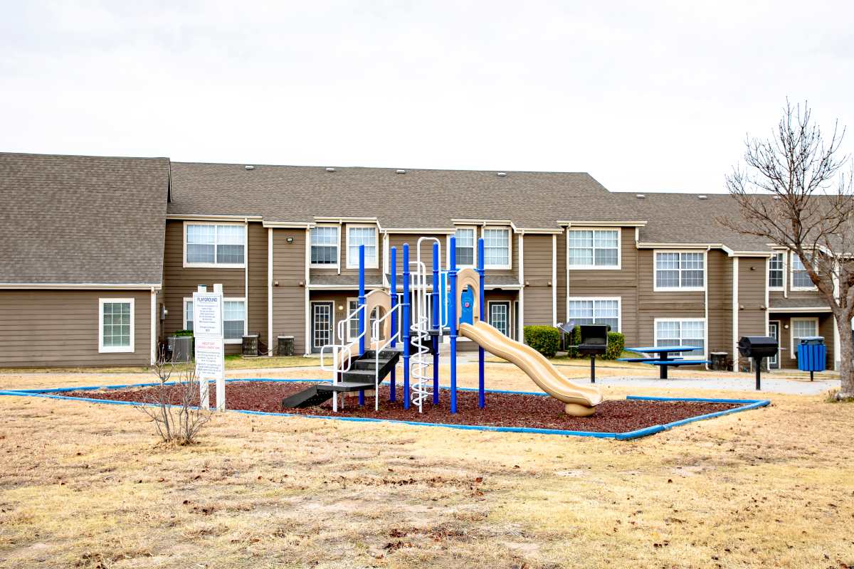 Playground with tot lot at Whispering Plains Apartments in Guymon, Oklahoma