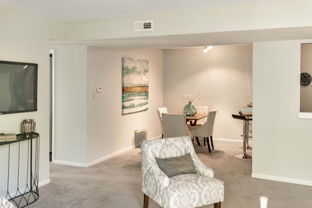 Living room with access to dining area at Bonhomme Village in Olivette. MO